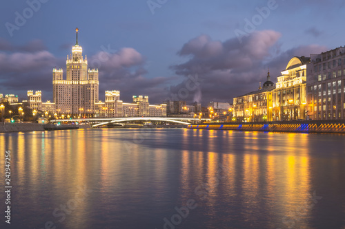 Moskva river night view with historical buildings and cloudy sky