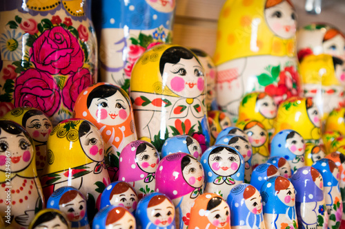 Dolls, Matryoshka Doll, in Gift Shop Shelf. Colorful Set of Various Wooden Stacking Women Figure Dolls in Traditional Old Russian Clothes.