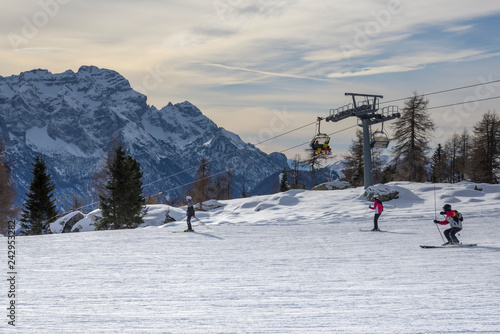 ski slopes with skiers. Trentino, Italy