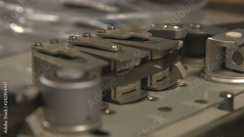 Close up of tape rolling in Nagra old tape recorder photo