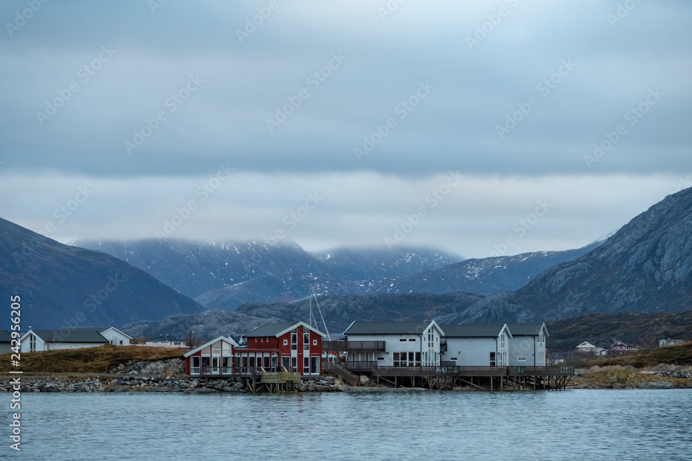 Typical buildings at the Atlantic shore on the Sammeroy island  (Troms Region) in Northern Norway above the Polar Circle