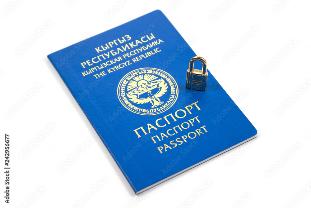 Blue passport of Kyrgyz Republic with lock on a white background, close-up. isolated Blue passport of Kyrgyz Republic with lock on a white background, close-up. isolated