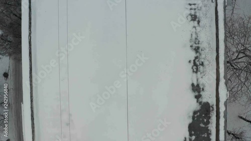 Wallpaper Mural Fly up above building roof covered with white snow. Winter foggy cityscape background. Torontodigital.ca
