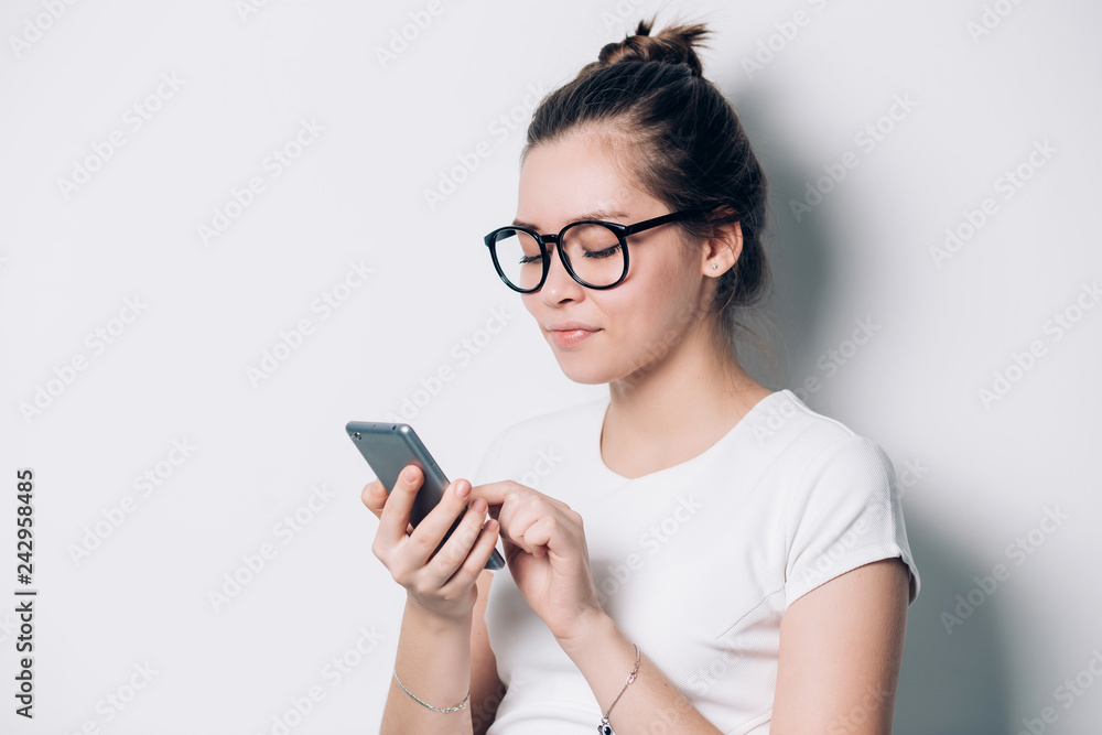 Thoughtful female employee searching information on web sites using modern technologies and wifi connection,