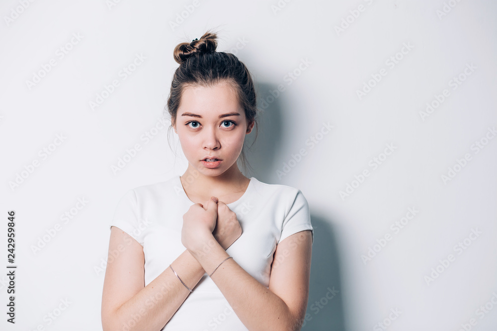 Porter young beautiful brunette woman crossing her arms on a white background Porter young beautiful brunette woman crossing her arms on a white background
