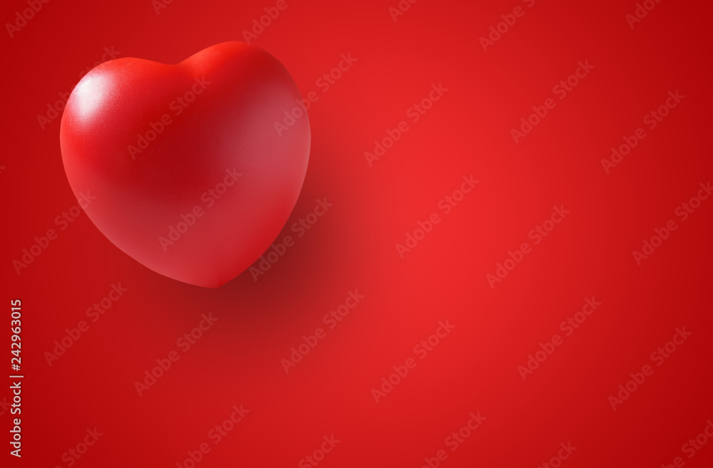 red heart rubber with shadow for love memorial or romantic on valentine day with wedding card and heart health on board or table with red paper or space and background