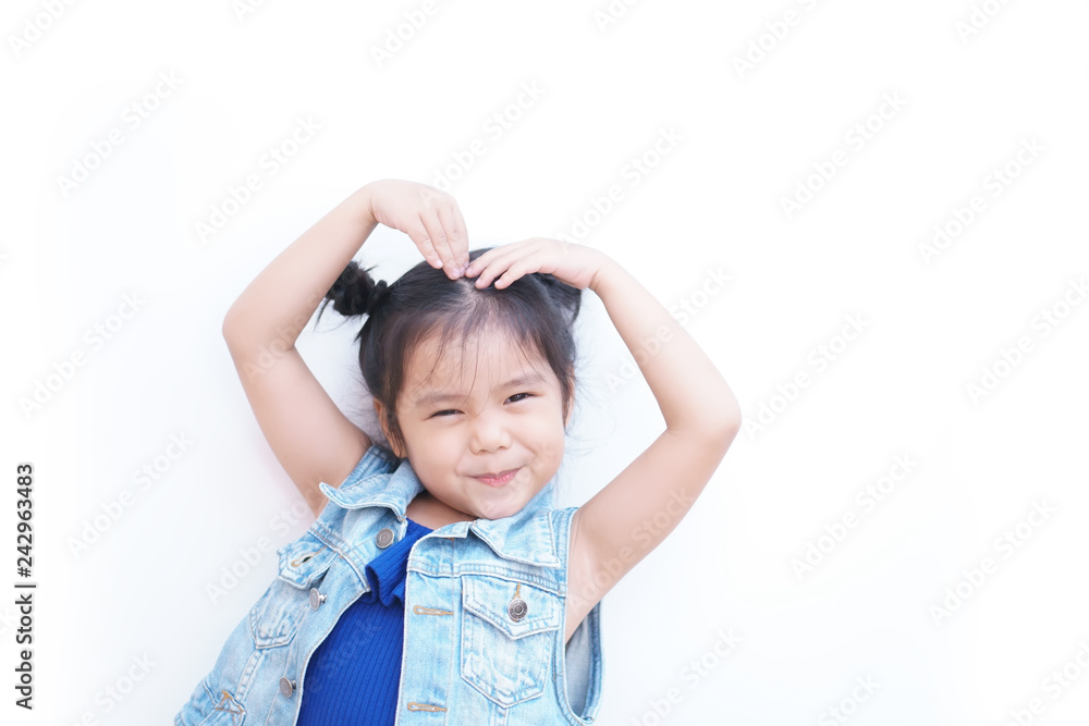 Asian child cute or kid girl lovely smiling and make heart by arm and hand on top head for love valentine day or wedding with happy and enjoy on white background isolated with wear jeans shirt Asian child cute or kid girl lovely smiling and make heart by arm and hand on top head for love valentine day or wedding with happy and enjoy on white background isolated with wear jeans shirt