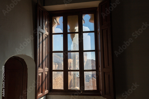 Window with views of the castle and a church