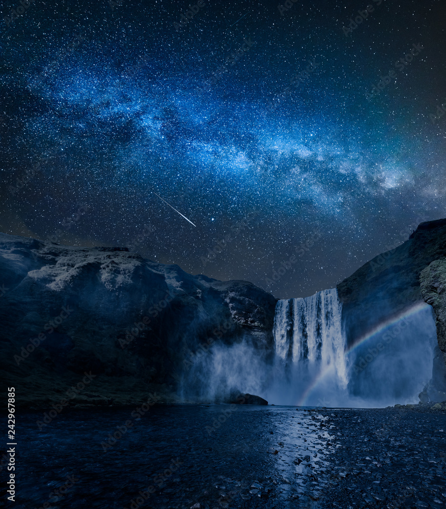 Fototapeta premium Stunning milky way and waterfall Skogafoss in Iceland at night