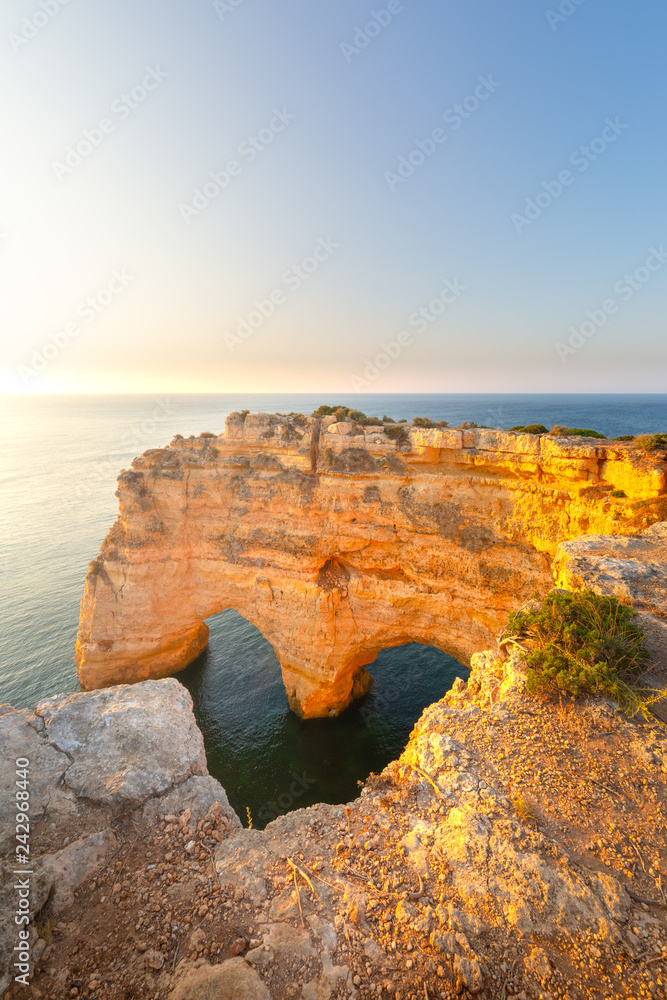 Heart Shaped arch rock in Algarve, Portugal. Praia da Marinha