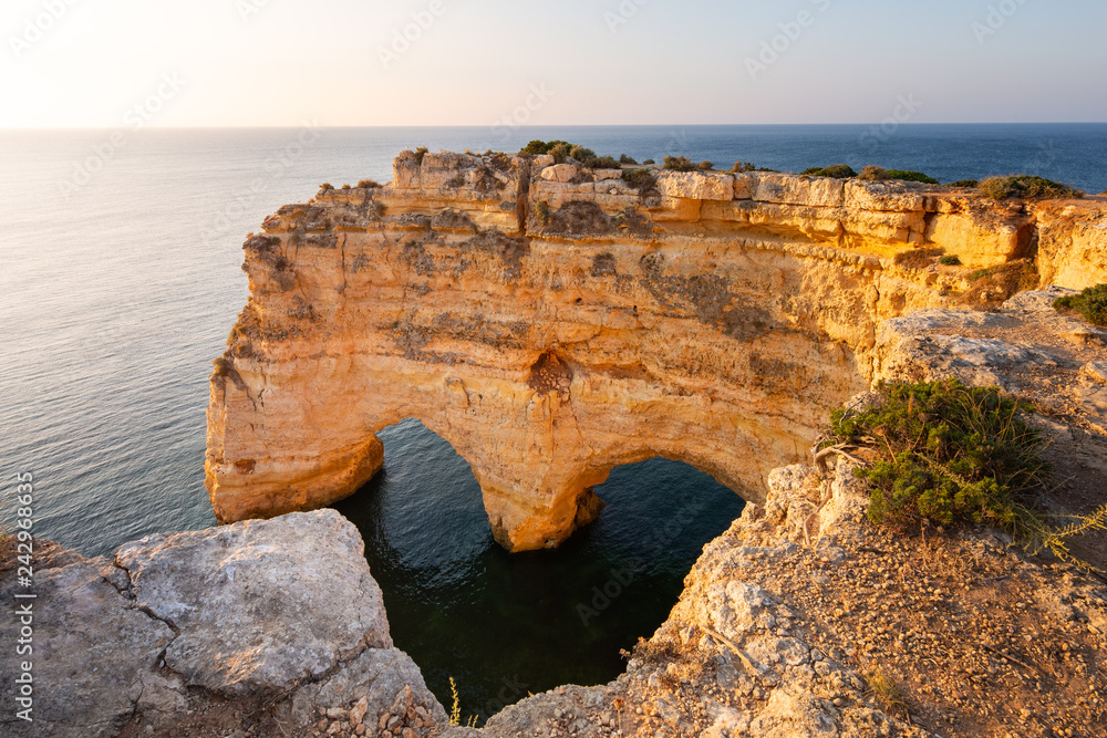 Heart Shaped arch rock in Algarve, Portugal. Praia da Marinha