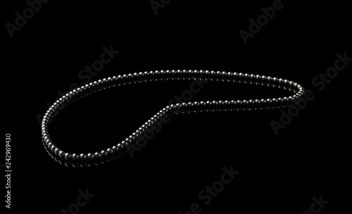 Chain of small magnetic balls on black background