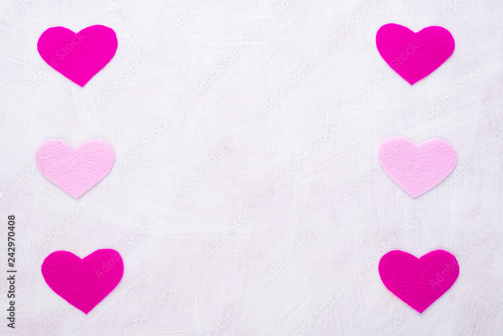 Background with hearts made of pink felt