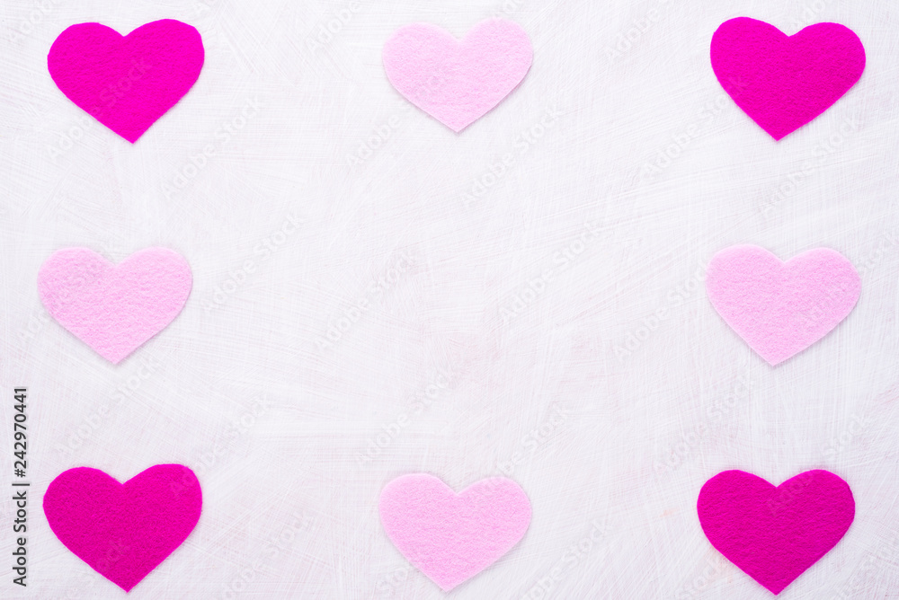 Background with hearts made of pink felt