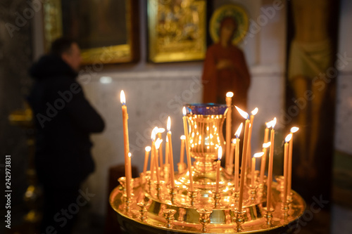 burning candles in an orthodox temple during the celebration of Christmas photo