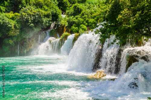 Waterfalls of Croatia.Tourists swimming near waterfalls in crystal clear water. Tourist spot in Dalmatia Krka National Park, place to go and visit