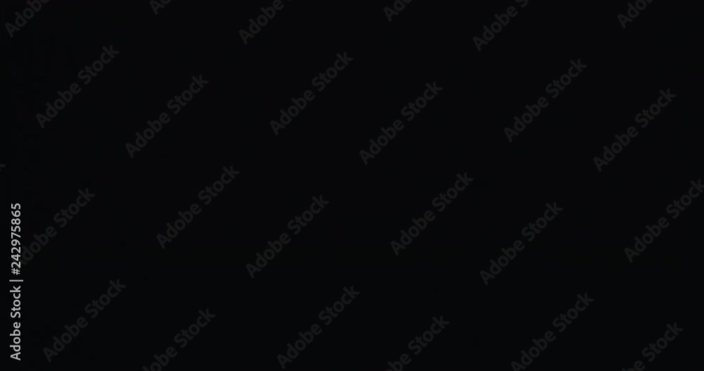 Slow motion hot sparks floating from side on black background, 60fps Slow motion hot sparks floating from side on black background, 60fps