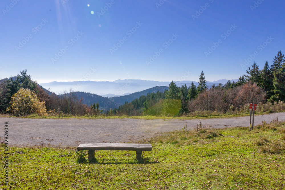 Way to mountain Golica in Karavanke, Slovenia, sun rays in blue sky