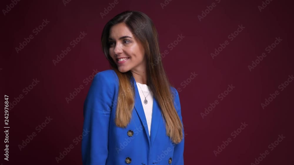 Closeup portrait of beautiful cheerful caucasian female smiling and posing in front of the camera Closeup portrait of beautiful cheerful caucasian female smiling and posing in front of the camera