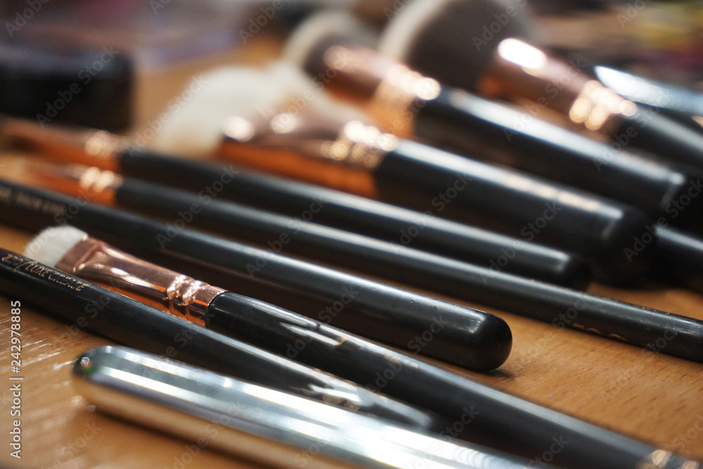 Set of cosmetic products lie on table. Make up brushes of professional beautician. Top view, flat lay. Cosmetic composition. Beauty concept. Set of cosmetic products lie on table. Make up brushes of professional beautician. Top view, flat lay. Cosmetic composition. Beauty concept.