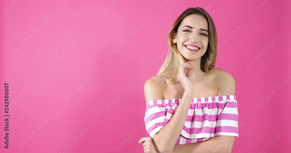 Pretty young woman smiling and blowing kiss on color background. Space for text
Pretty young woman smiling and blowing kiss on color background. Space for text