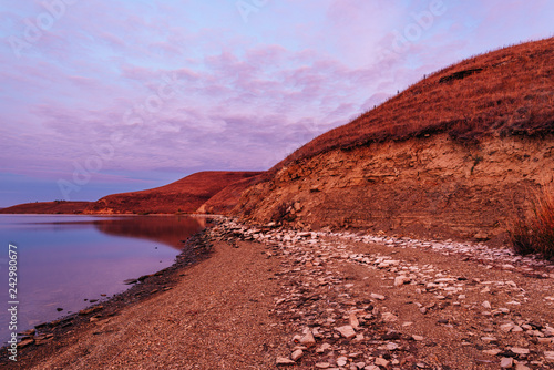 Sunrise on the hilly coast of Zay river