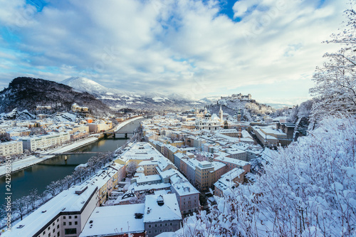 Panorama of Salzburg in winter: Snowy historical center, sunshine