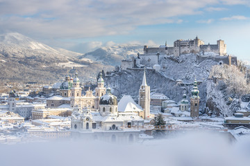 Panorama of Salzburg in winter: Snowy historical center, sunshine