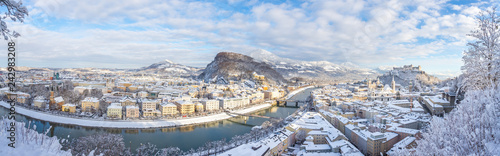 Fototapeta Naklejka Na Ścianę i Meble -  Panorama of Salzburg in winter: Snowy historical center, sunshine