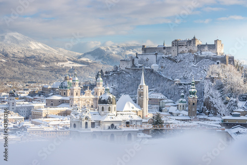 Panorama of Salzburg in winter: Snowy historical center, sunshine photo