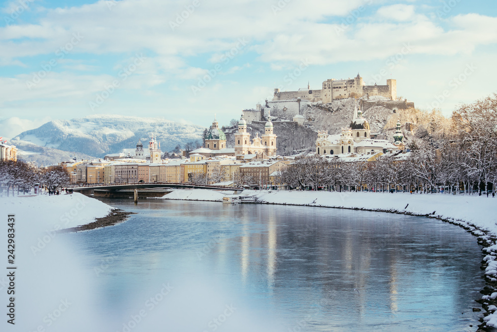 Panorama of Salzburg in winter: Snowy historical center, sunshine
