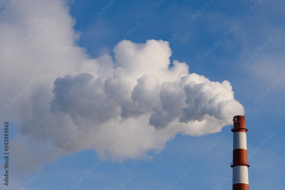 The pipe smokes against the blue sky. Time lapse accelerated twenty times. The pipe smokes against the blue sky. Time lapse accelerated twenty times.
