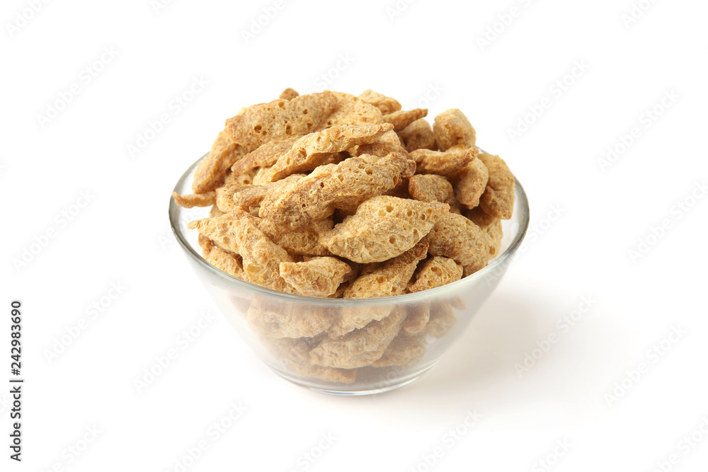 Raw soy chunks in glass bowl isolated on white background. Dry soya pieces meat used in vegetarian and vegan food. Raw soy chunks in glass bowl isolated on white background. Dry soya pieces meat used in vegetarian and vegan food.