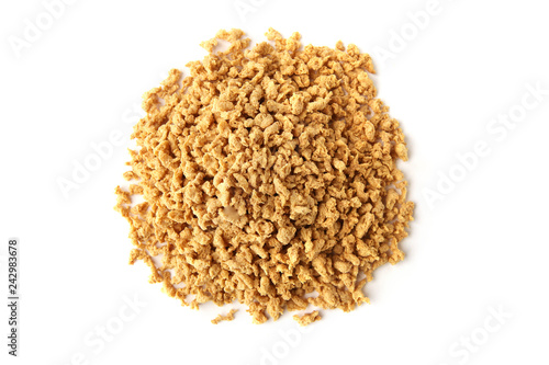 Raw soy mince pile isolated on white background. Dry soya mince meat. top view