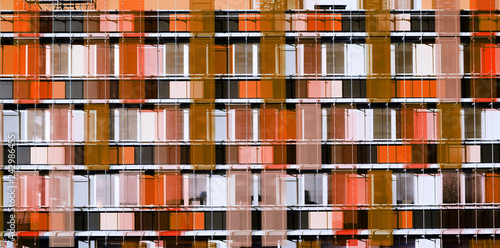 Graphic facade building of skyscraper - coral color