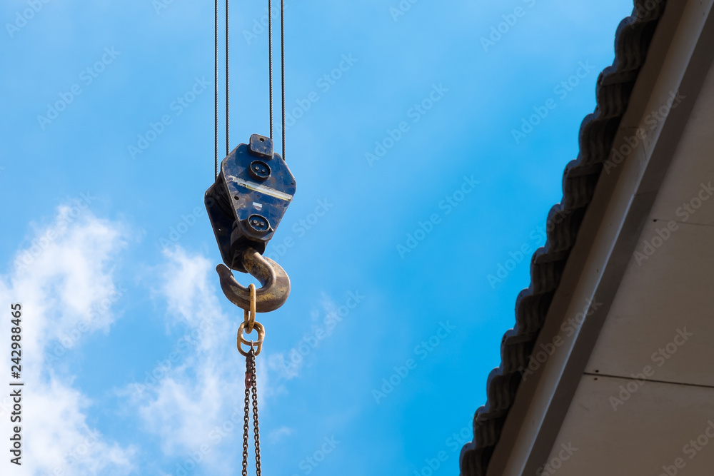 Crane Hook lifting  for construction on blue sky,steel hook and chain, copy space