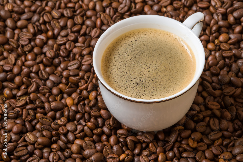 cup of coffee with roasted beans cup of coffee with roasted beans