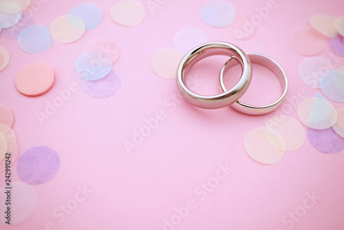 Wedding rings on pastel colors with copy space