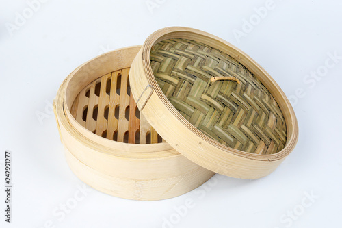 Wooden bamboo dim sum steamer on white background