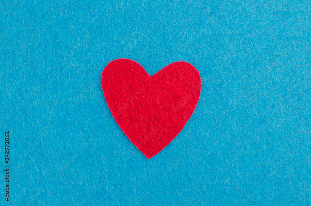 Hand made textile red heart. Isolated on white background Hand made textile red heart. Isolated on white background