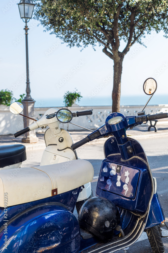 Old vintage italian moped parked at Numana Sirolo with sea at background - Ancona Mount Conero Marche region Italy - beautiful tiny pearl of the Adriatic Sea