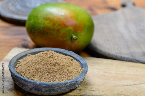 Amchoor or aamchur, mango powder, fruity spice powder made from dried unripe green mangoes in India, used to flavor foods close up