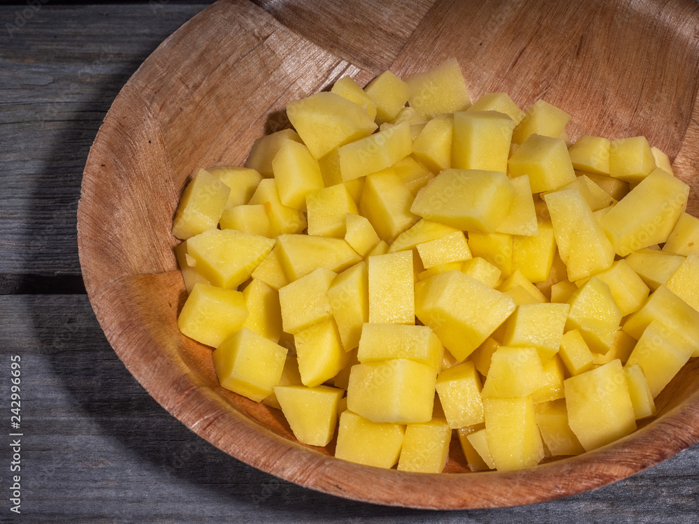 Preparation for cooking lunch or salad. Diced potatoes. Preparation for cooking lunch or salad. Diced potatoes.