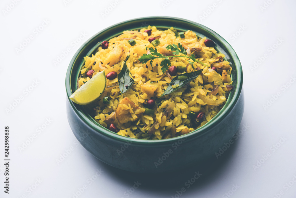 Aloo/Kanda Poha or Tarri Pohe with spicy chana masala/curry. selective focus Aloo/Kanda Poha or Tarri Pohe with spicy chana masala/curry. selective focus