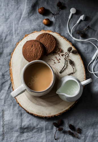 Coffee break - coffee and chocolate cookies on grey background  top view. Cozy home still life