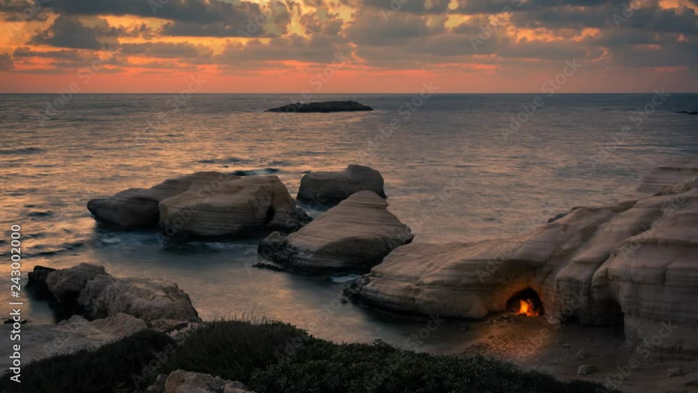 Cinemagraph sunset seascape with bonfire Cinemagraph sunset seascape with bonfire