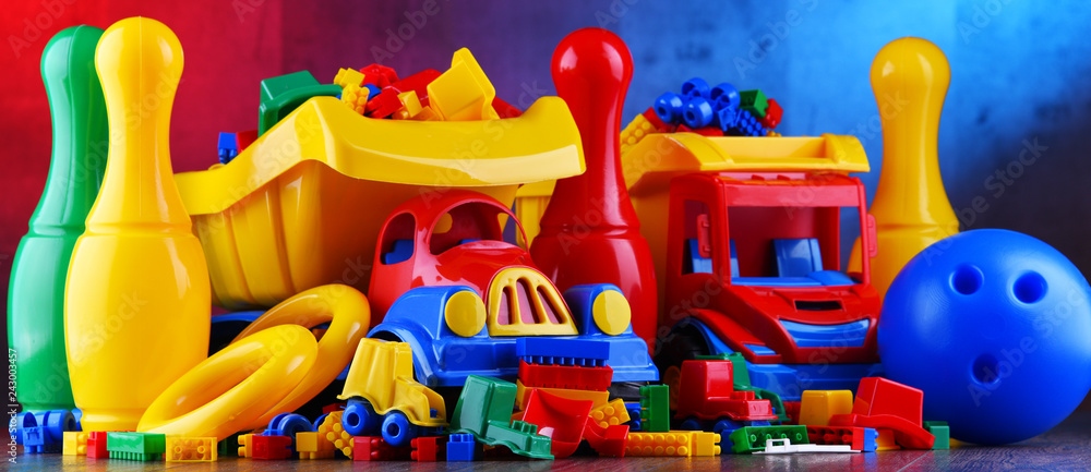Composition with colorful plastic children toys - obrazy, fototapety, plakaty 