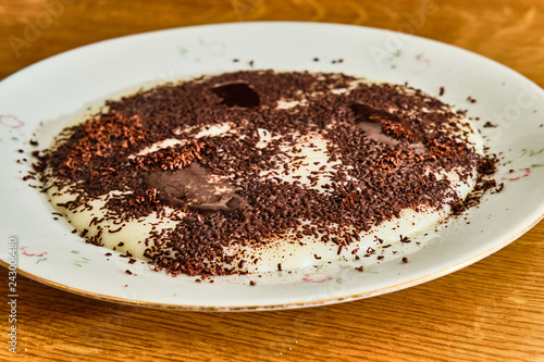 Semolina pudding with gratted chocolate photo