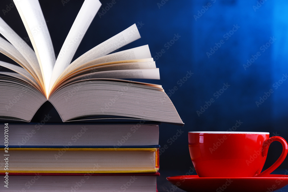 Composition with books and cup of coffee on the table Composition with books and cup of coffee on the table