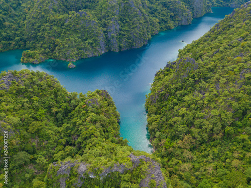 Aerial view to Kayangan lake with blue water, on a tropical island Coron. Lake in the mountains covered with tropical forest. Palawan, Philippines.